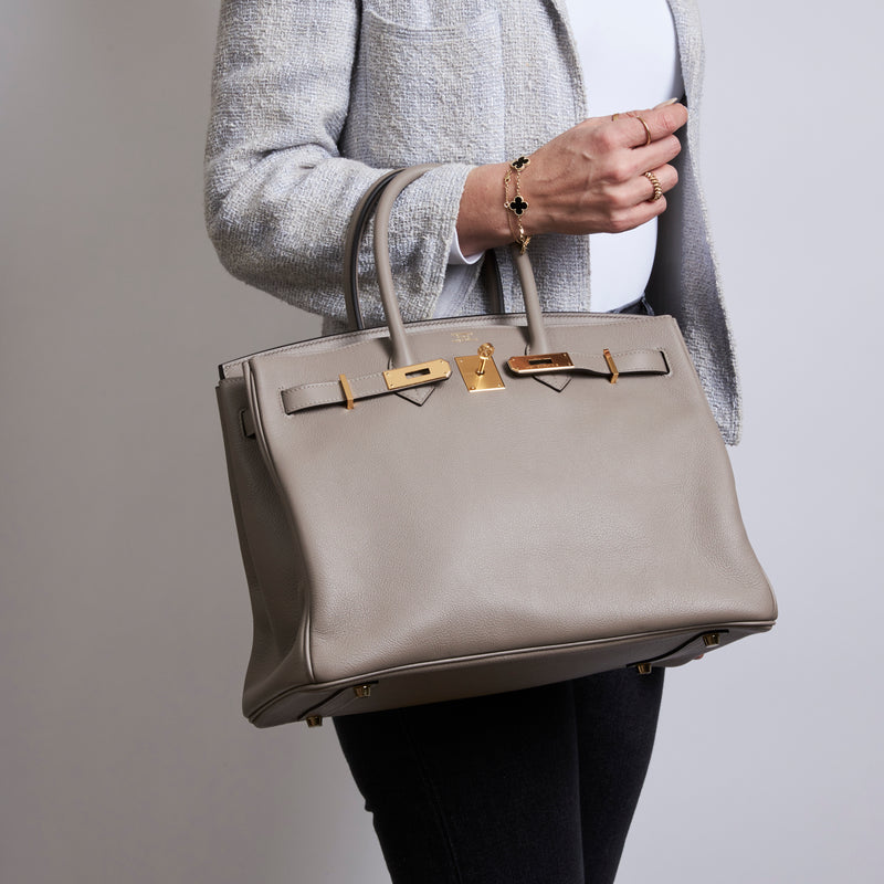 Excellent Pre-Loved Taupe Grey Grained Leather top Handle Bag. (on body)