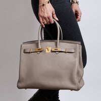 Excellent Pre-Loved Taupe Grey Grained Leather top Handle Bag. (on body)