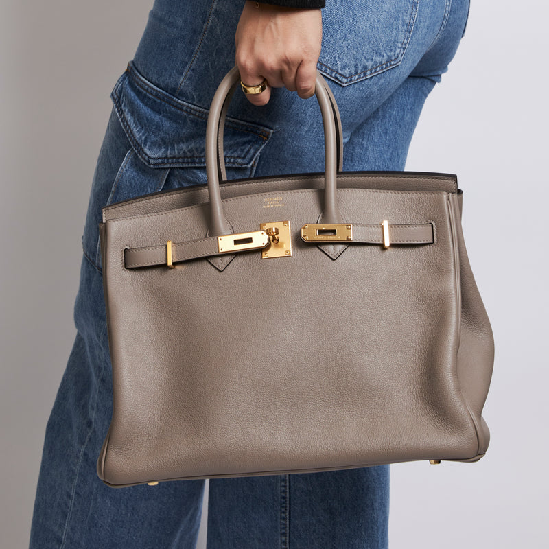 Excellent Pre-Loved Taupe Grey Grained Leather top Handle Bag. (on body)