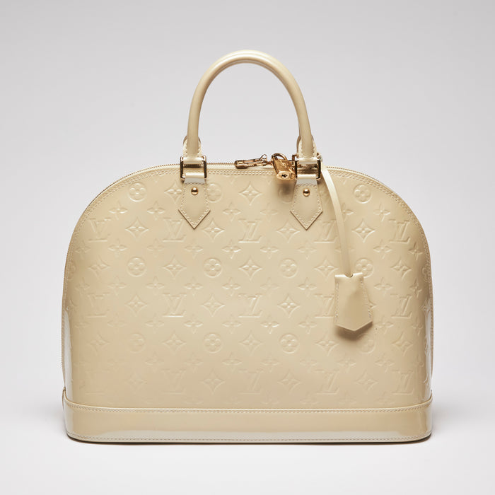 Pre-Loved Large Monogram Embossed Ivory Patent Leather Half Dome Shaped Top Handle Bag.  (front)
