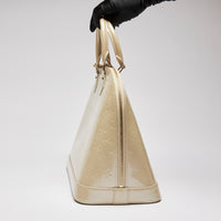 Pre-Loved Large Monogram Embossed Ivory Patent Leather Half Dome Shaped Top Handle Bag.  (side)