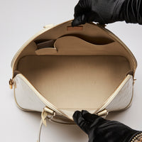 Pre-Loved Large Monogram Embossed Ivory Patent Leather Half Dome Shaped Top Handle Bag.  (interior)