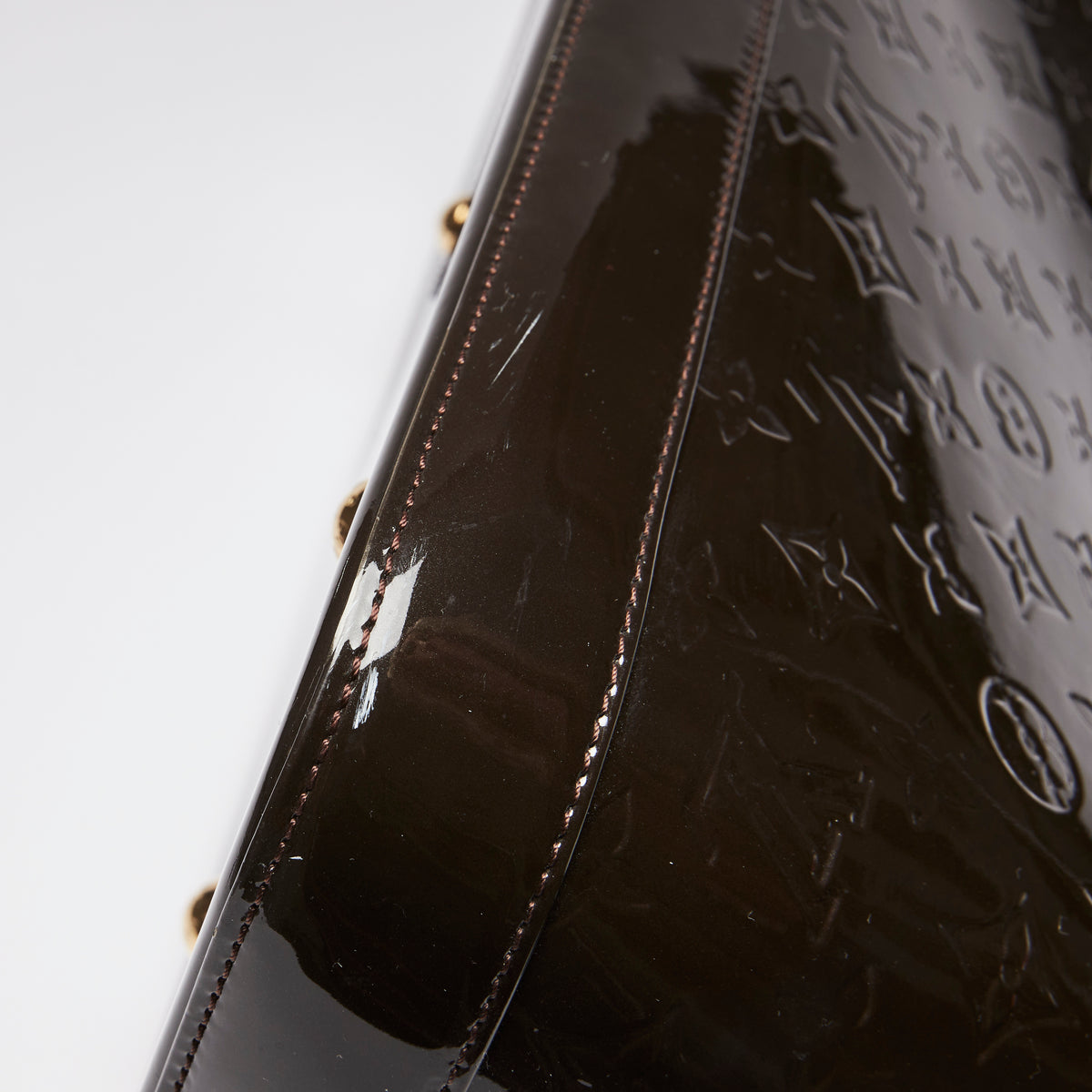 Pre-Loved Dark Plum Monogram Embossed Patent Leather Top Handle Bag. (scuff marks)