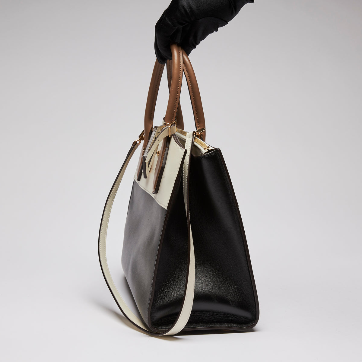 Excellent Pre-Loved Ivory/Dark Beige/Black Smooth Leather Top Handle Bag. (side)