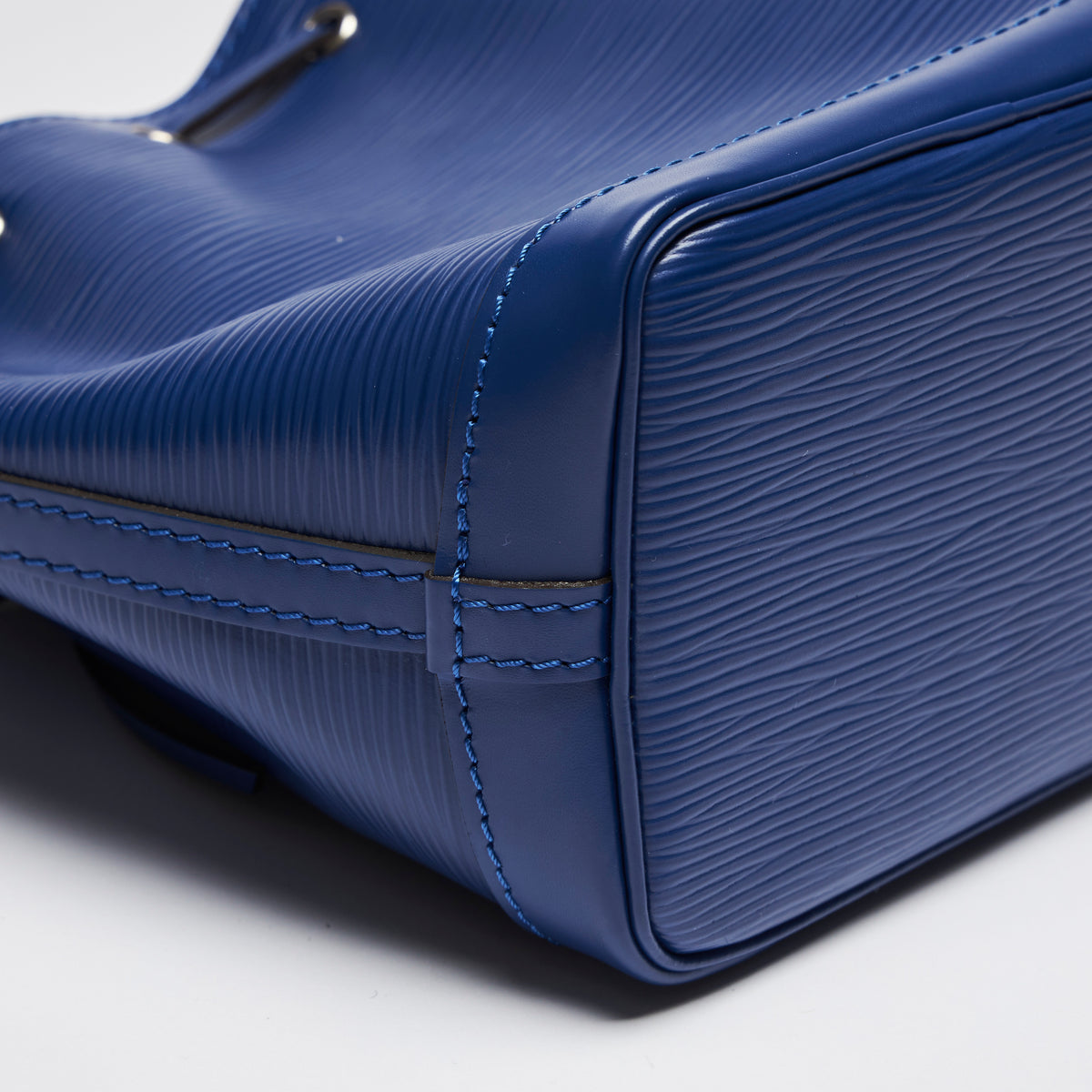 Excellent Pre-Loved Blue Textured Leather Mini Bucket Bag. (corner)