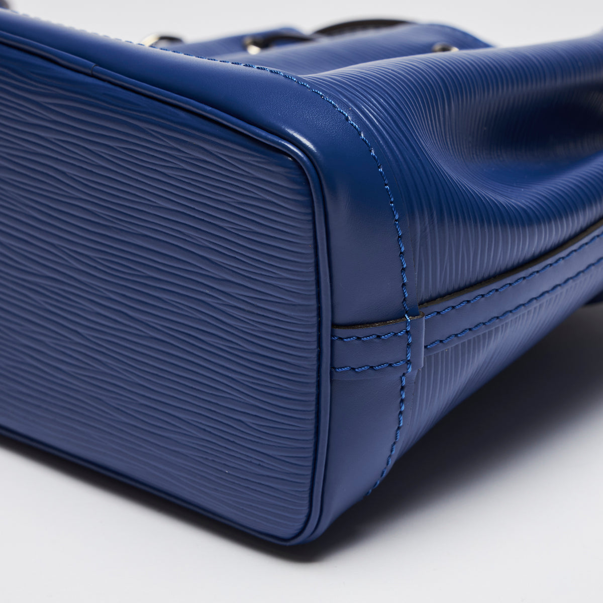 Excellent Pre-Loved Blue Textured Leather Mini Bucket Bag.(corner)