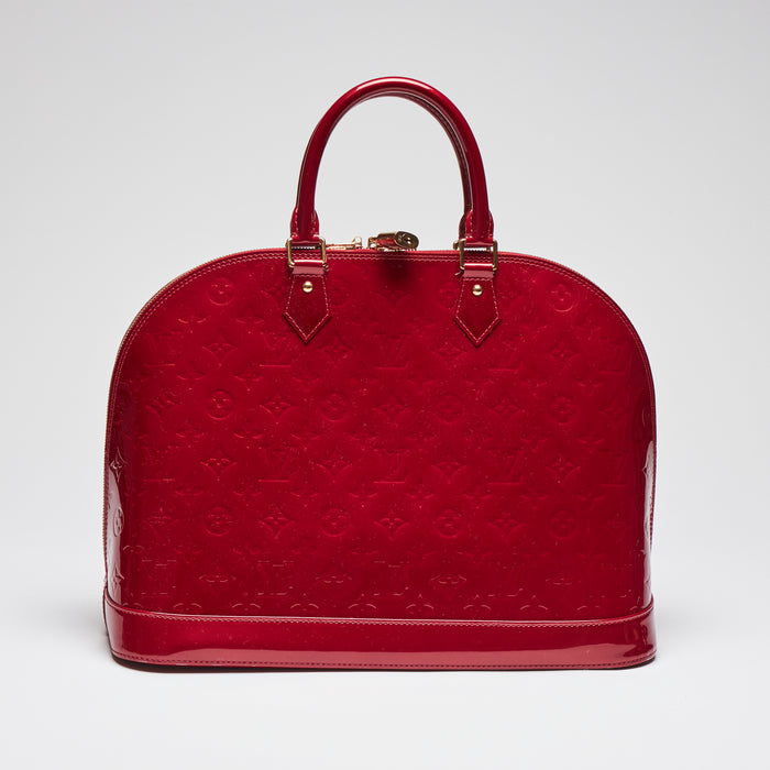 Pre-Loved Large Monogram Embossed Red Patent Leather Half Dome Shaped Top Handle Bag. (front)