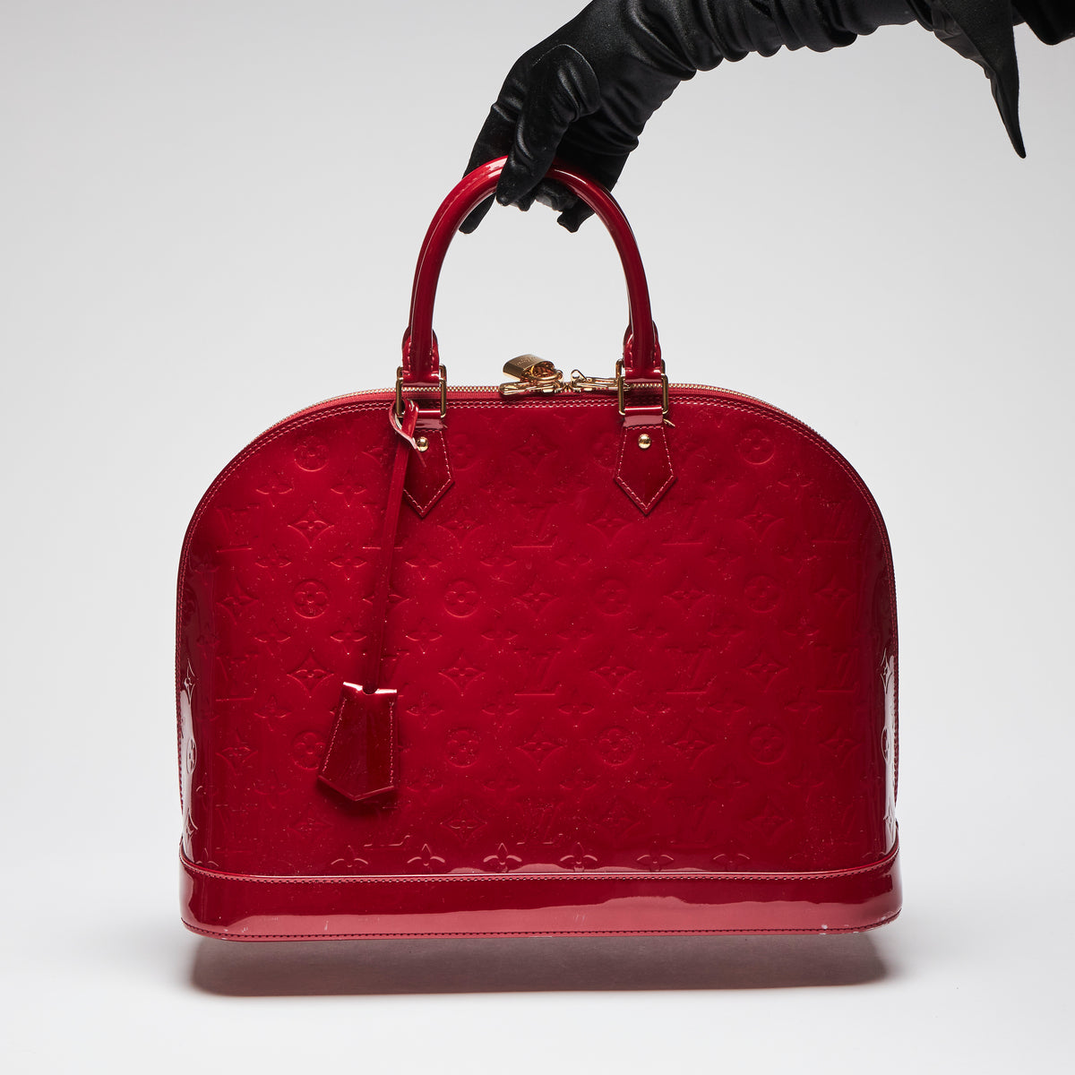 Pre-Loved Large Monogram Embossed Red Patent Leather Half Dome Shaped Top Handle Bag. (back)