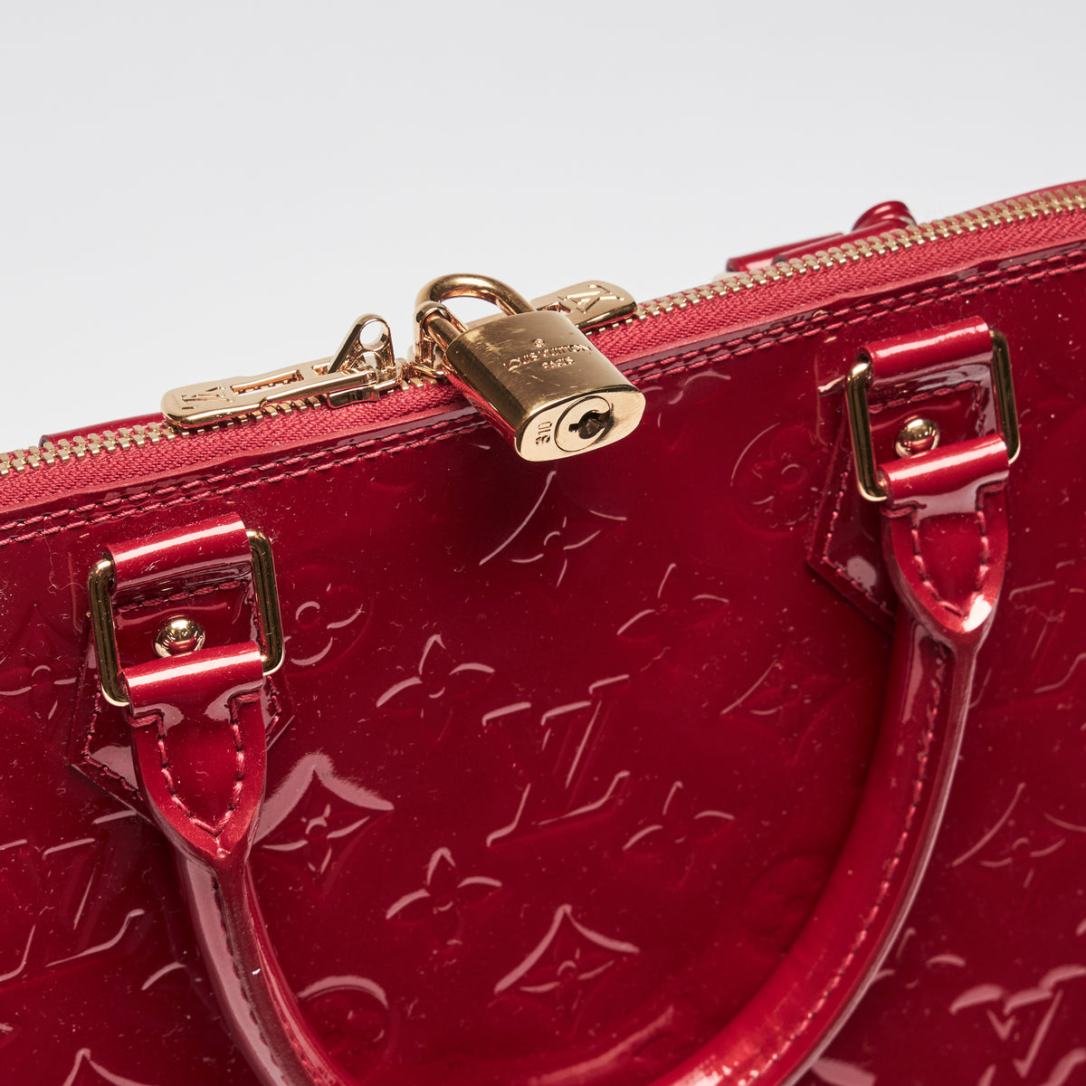 Pre-Loved Large Monogram Embossed Red Patent Leather Half Dome Shaped Top Handle Bag. (lock)