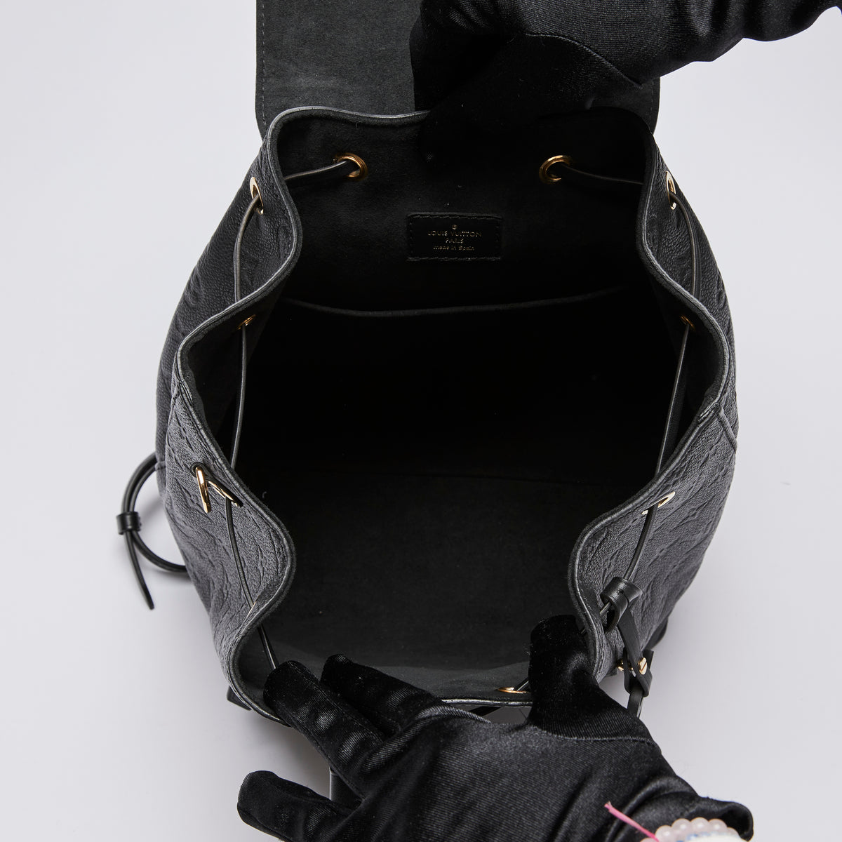 Excellent Pre-Loved Black Monogram Embossed Grained Leather Back Pack.(interior)