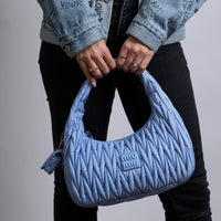 Excellent Pre-Loved Light Blue Nylon Pleated Shoulder Bag.(on body)