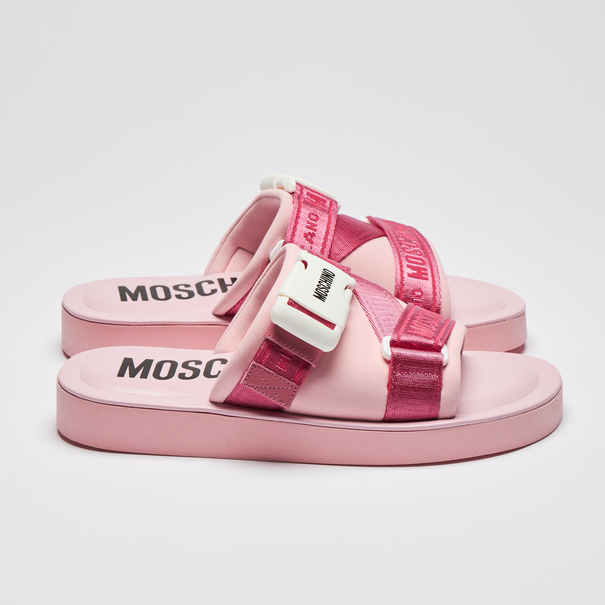 Excellent Pre-Loved Pink Slides with White Buckle Detail and Pink Ribbon Logo Strap.(side)