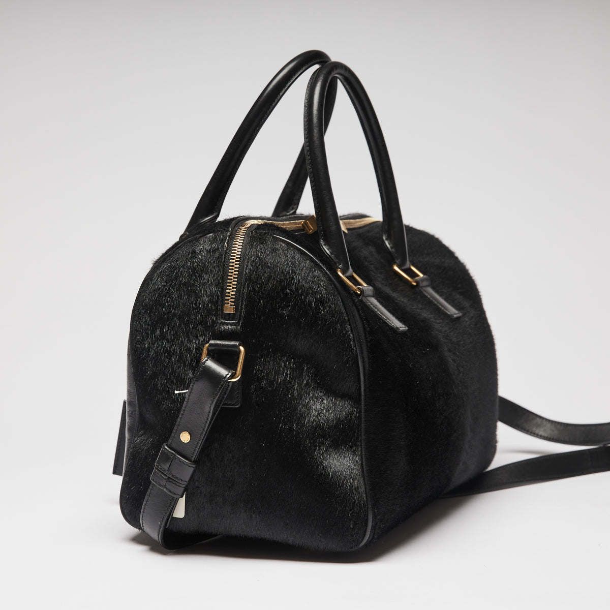 Pre-Loved Black Leather and Pony Hair Duffle Bag with Removable Shoulder Strap. (side)