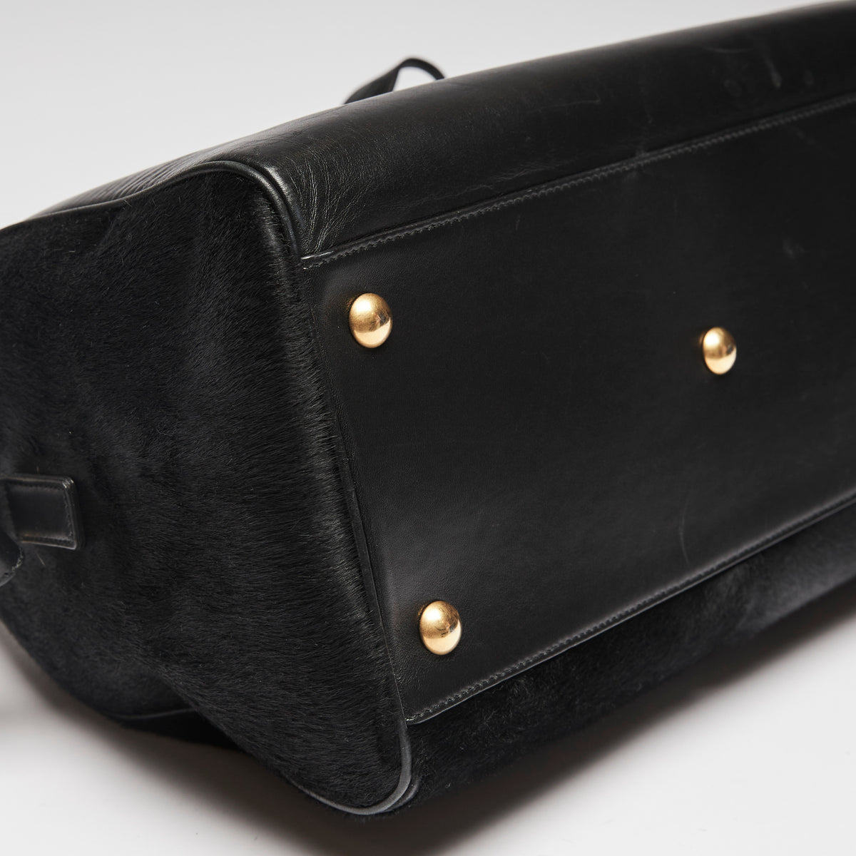 Pre-Loved Black Leather and Pony Hair Duffle Bag with Removable Shoulder Strap. (corner)