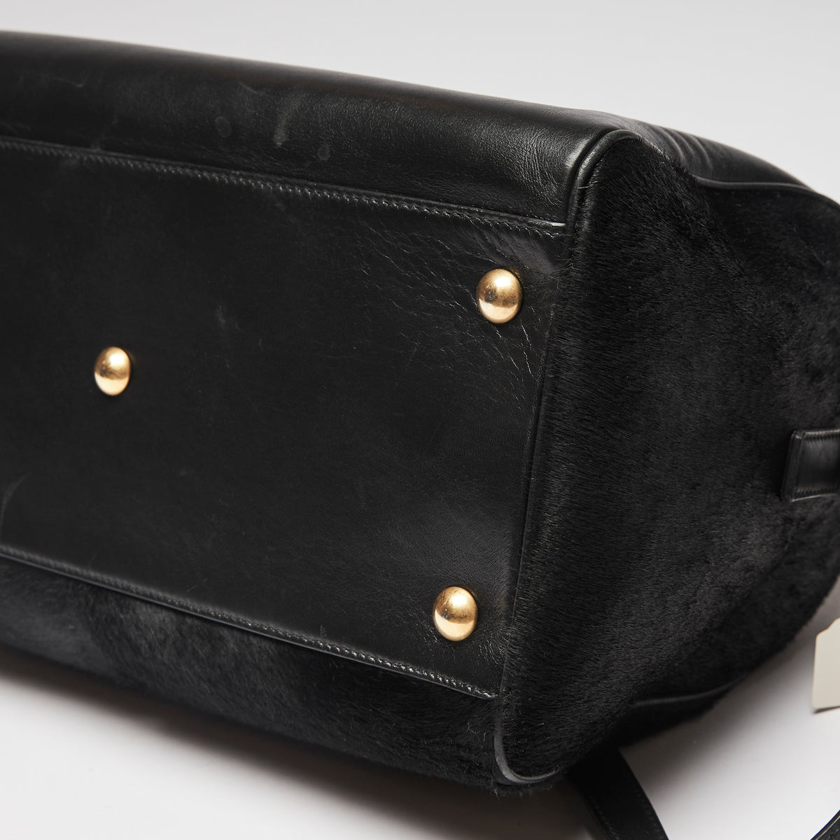 Pre-Loved Black Leather and Pony Hair Duffle Bag with Removable Shoulder Strap.  (corner)
