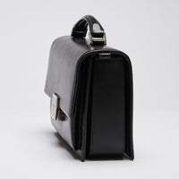 Excellent Pre-Loved Black Smooth Leather Top Handle Flap Over Shoulder Bag with Aged Silver Tone Hardware.(side)