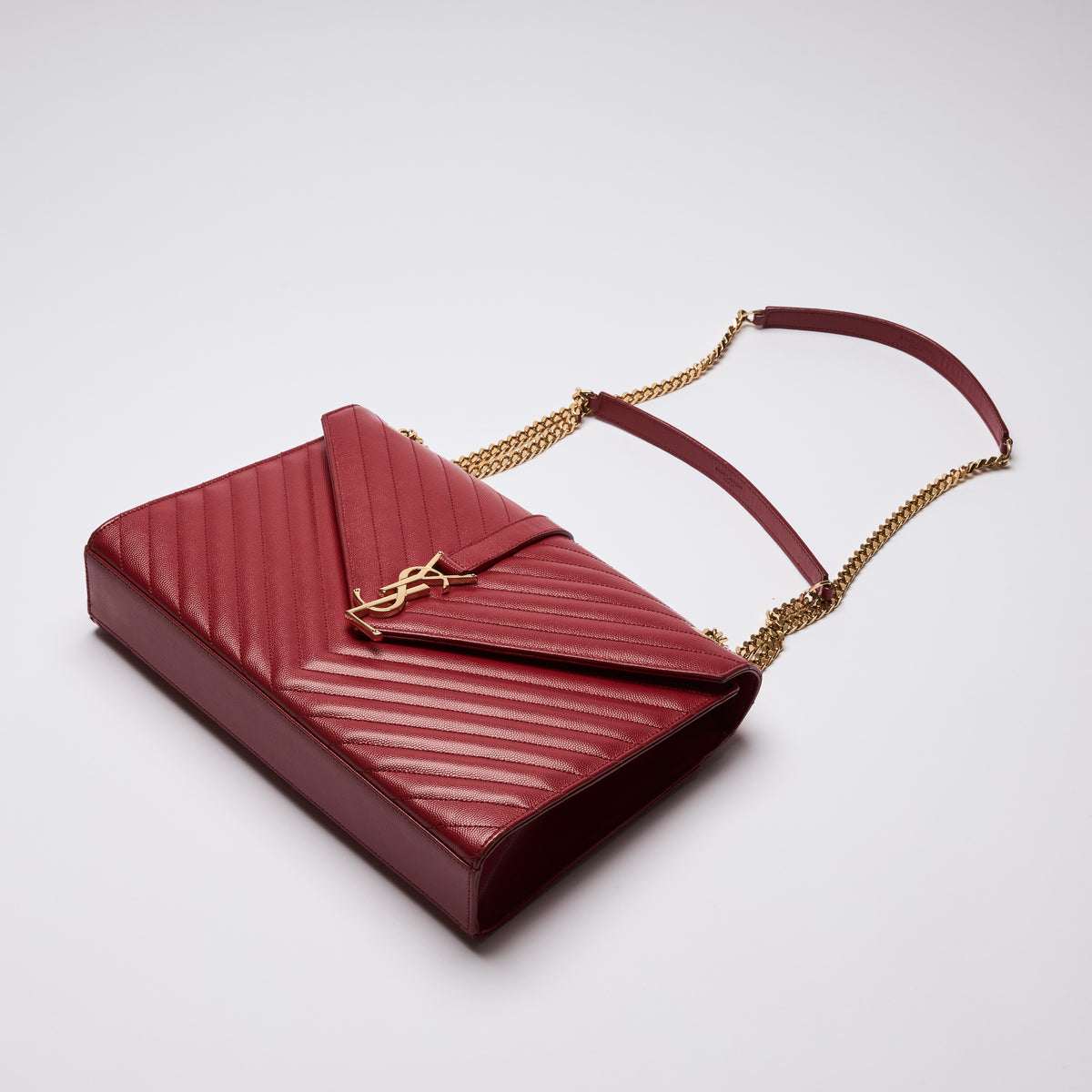 YSL Red Grained Leather Chevron Large Envelope Bag (flat lay)