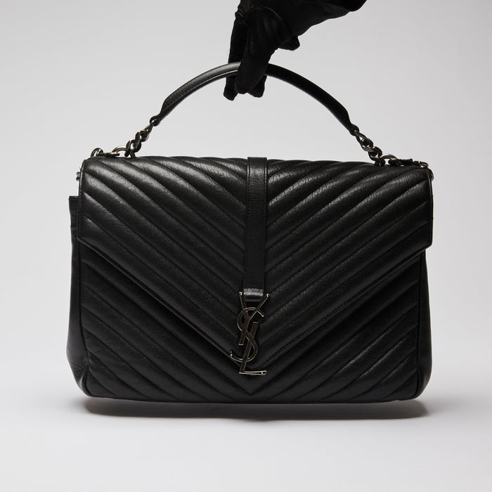 Pre-Loved Black Grained Leather Chevron Stitched Flap Bag with Removable Shoulder Chain and Handle. (front)