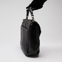 Pre-Loved Black Grained Leather Chevron Stitched Flap Bag with Removable Shoulder Chain and Handle. (side)