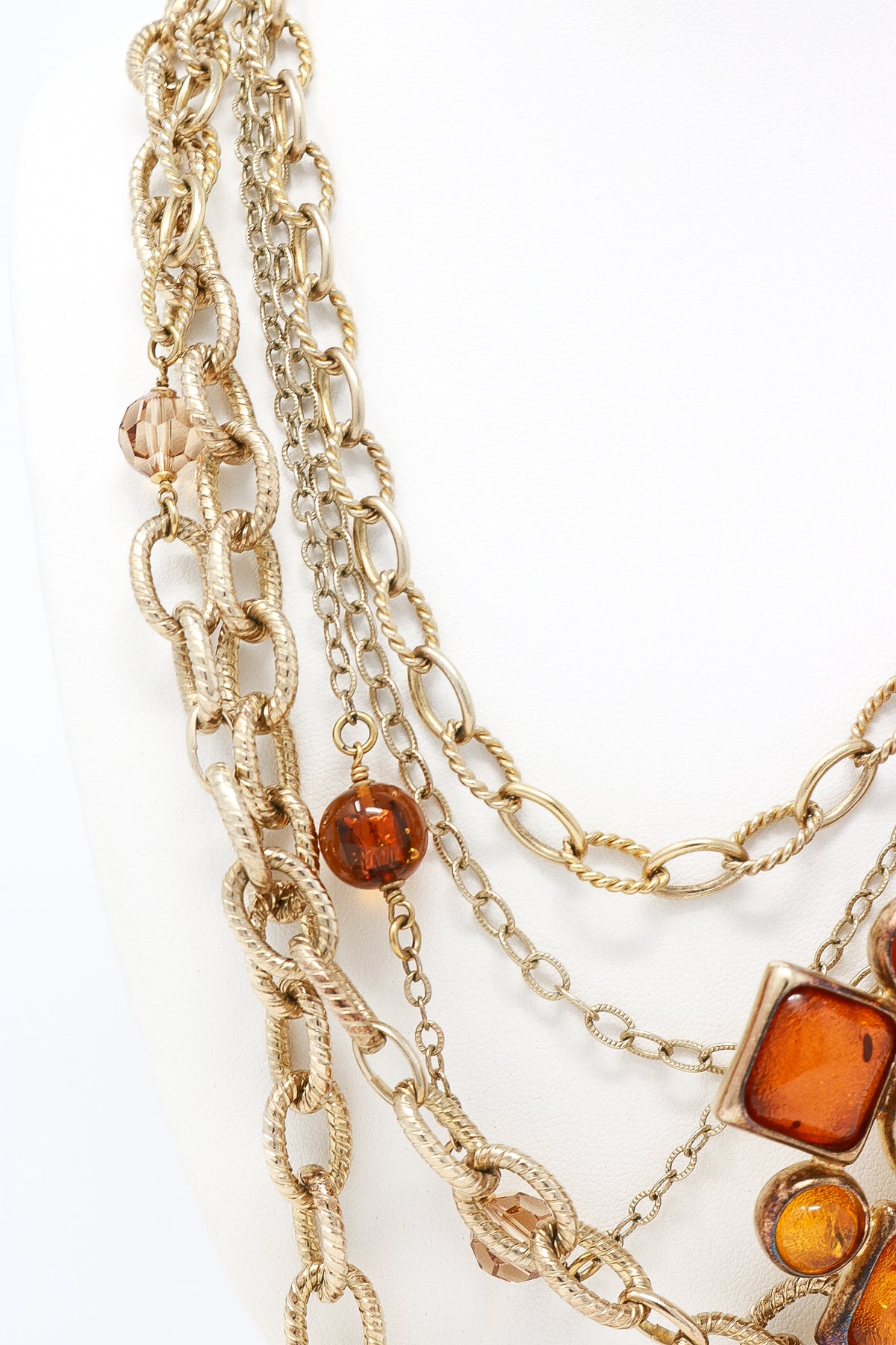 aged gold multichain necklace with orange resin ornament (detail view)
