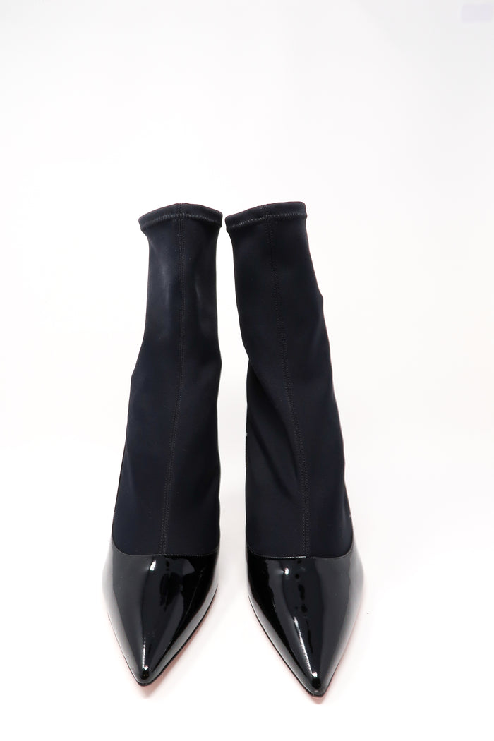 black patent leather heels with black nylon ankle socket attachment (front view)