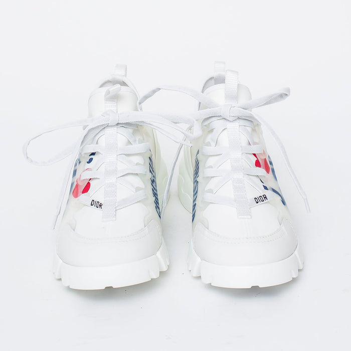 white fabric lace up sneakers with blue logo printed on side (front view)
