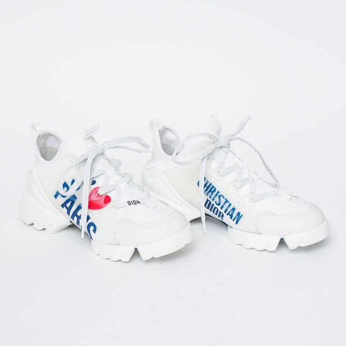 white fabric lace up sneakers with blue logo printed on side (side view)