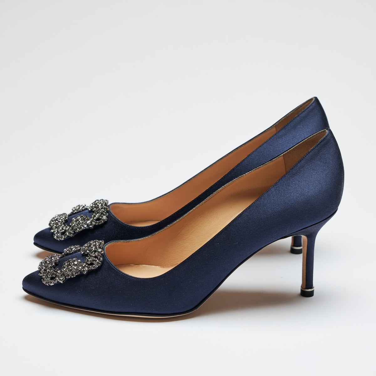 navy blue satin heels with dark grey crystal buckle ornament (side view)