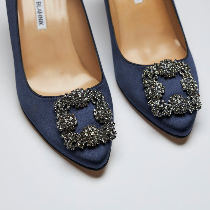 navy blue satin heels with dark grey crystal buckle ornament (close up view)