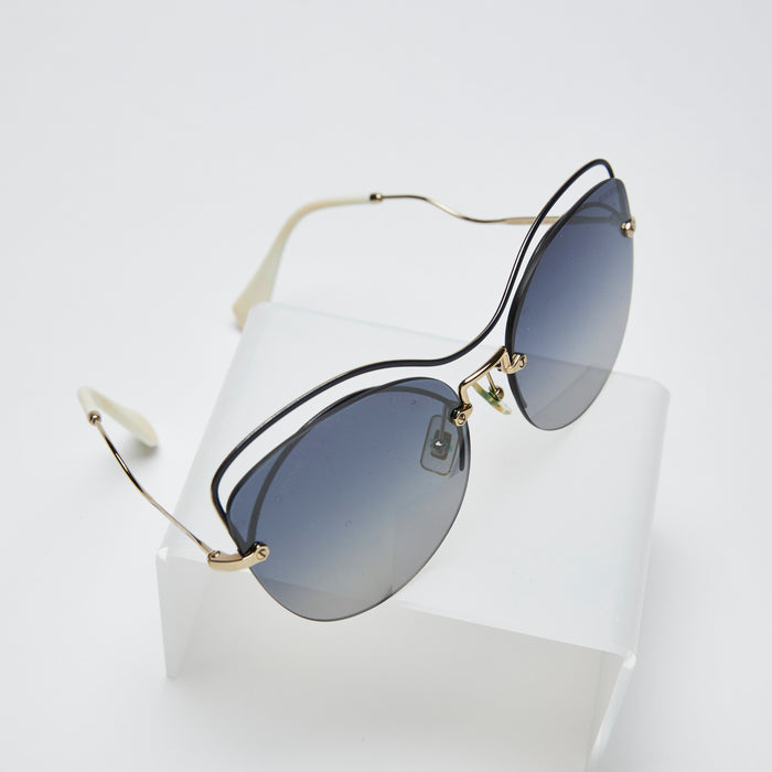 cat eye frameless sunglasses with blue gradient tint lens (top view)